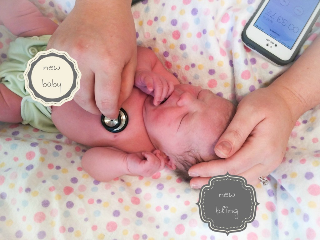 I'm sure newborn checks go so much better with that bling on her hand! ;-)